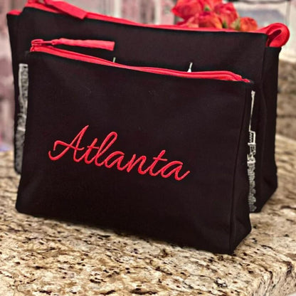 Black bags with red zipper and &