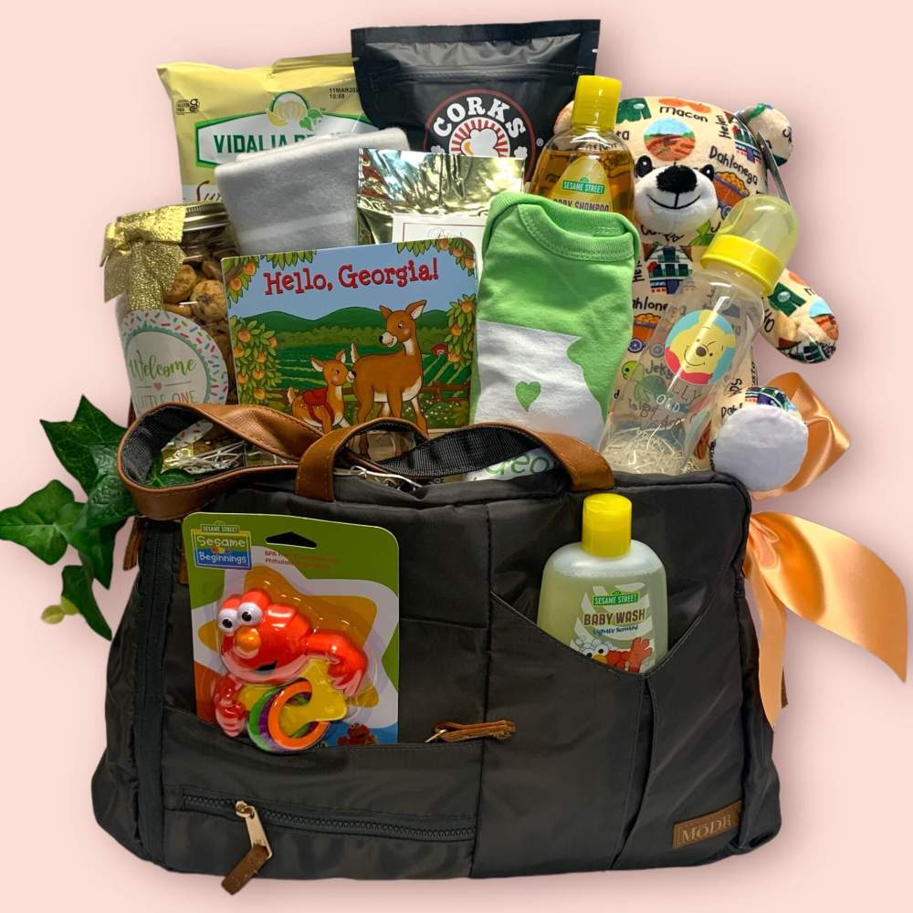 Welcome Little One Baby Gift Basket which includes assorted baby products including teether, bath products, baby book and assorted snacks for the parents.