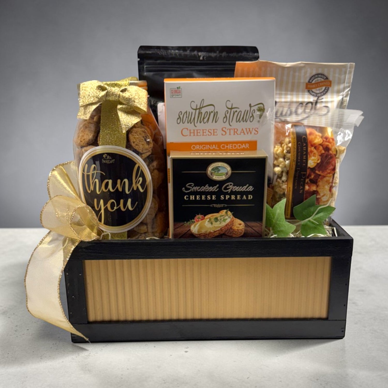 Gift basket with cheese straws, cheese spread, and a &