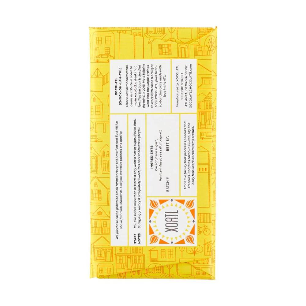 Back label of dark and salty chocolate bar in yellow package with geometric patterns and text on a white background