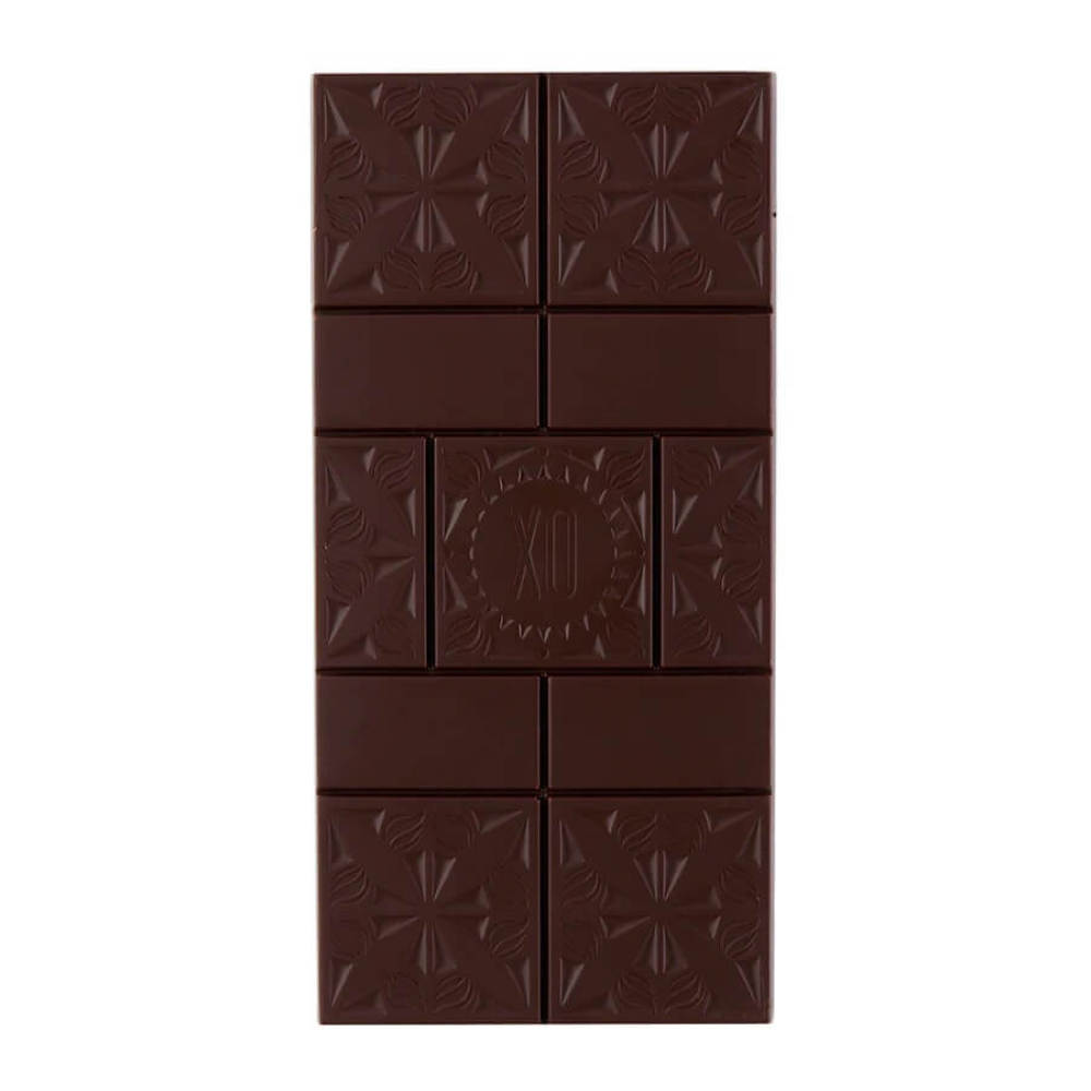 Dark chocolate bar with embossed design on a white background